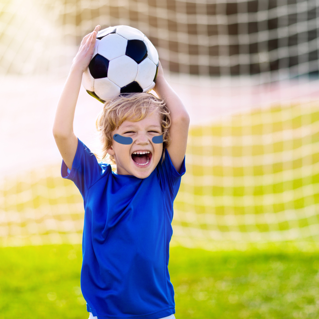 SunTape
Child holding a soccer ball on a sports field